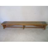 An industrial wooden bench from the Axminster Carpets factory - length 299cm, width 38cm, height
