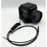 A Mamiya RZ67 Professional Camera Body and No.1 extension tube plus twin release cable, serial no