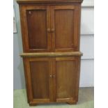 A mahogany cupboard on cupboard.