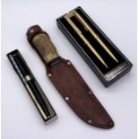 A vintage Carl Schlieper, Solingen, Germany knife in leather sheath along with Parker and