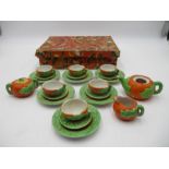 A child's vintage miniature tea set, pumpkin themed, marked "golden series rec. foreign". In a