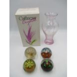 A boxed Caithness Crystal Flamenco glass vase, along with three glass paperweights including