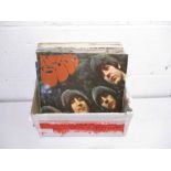 A collection of 12" vinyl records including The Beatles (Let it Be, Rubber Soul, A Hard Day's