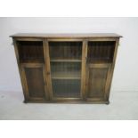 An oak bookcase with two cupboards