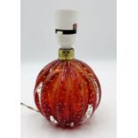 A Murano ruby red table lamp in good condition with label to base