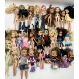 A collection of various Bratz dolls