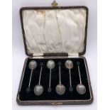 A cased set of hallmarked silver coffee bean spoons