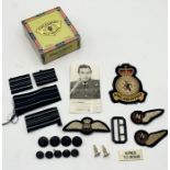 A collection of RAF cloth badges, emblems, shoulder flashes and buttons worn by Flight Lieutenant