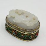 An Oriental silver gilt and jade trinket box with enamel detail
