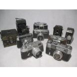 A collection of various cameras including Zeiss Ikon, Yashica, Voigtlander etc.