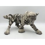 A Raku pottery model of a tiger signed K Rudge