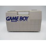 A Game Boy portable Carry-All case with Nintendo Game Boy handheld console and sixteen games
