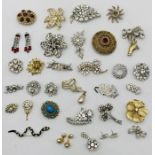 A collection of vintage costume jewellery brooches etc.