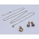 A collection of 9ct gold, a pendant, earrings along with a fine 9ct chain, total weight 1.8g