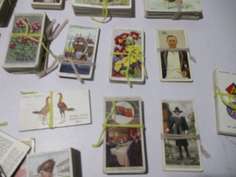 A collection of vintage cigarette cards including John Player & Sons, Churchman's, WD & HO Wills. - Image 5 of 11