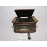 A Roadstar HIF-1996D+BT wooden retro style record player with turntable, radio, CD, cassette,