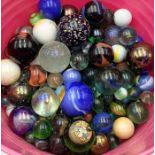 A large quantity of various sized vintage and antique marbles