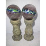 A pair of gardensolar powered "gazing balls".