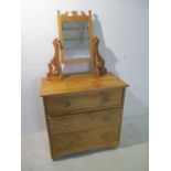 An antique satin wood dressing chest with three drawers