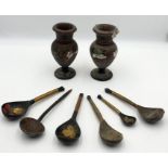 A small collection of lacquered wooden vases and spoons made in the USSR