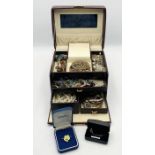 A collection of costume jewellery in carry case including brooches, bracelets etc