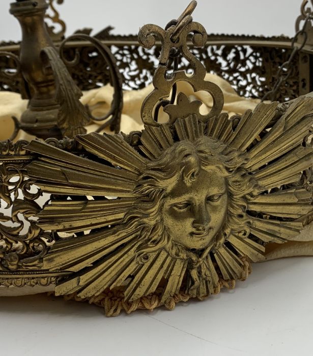 A gilt hanging light in the French style with sunburst cherub motifs and fabric drop shade - Image 3 of 4