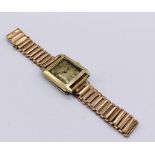 A tested 14ct gold vintage Lorie wristwatch on gold plated strap