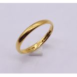 A 22ct gold wedding band, weight 2.9g