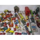 An assortment of vintage play worn toys including die cast Matchbox, Lledo, Dinky etc.