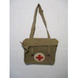 A vintage Red Cross canvas shoulder bag, marked on inside with a board arrow stamp and dated 1955
