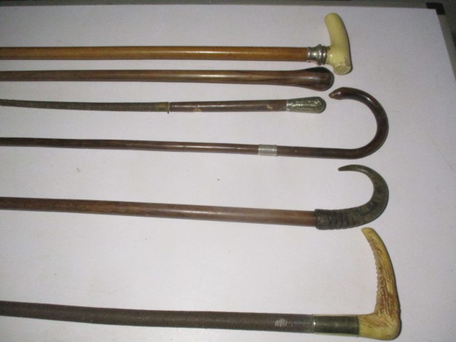 A collection of various walking sticks and crops including a G & J Zair crop ( A/F), silver