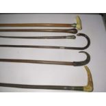 A collection of various walking sticks and crops including a G & J Zair crop ( A/F), silver