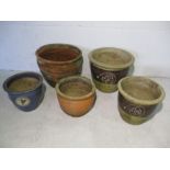 A collection of five various garden pots