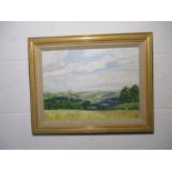A framed oil painting of a countryside scene - overall size 39cm x 49cm