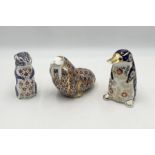 Three Royal Crown Derby paperweights with gold buttons comprising of a platypus, chipmunk and