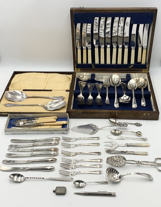 A collection of silver plated cutlery along with a yard of lead propelling pencil