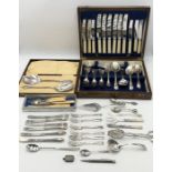A collection of silver plated cutlery along with a yard of lead propelling pencil