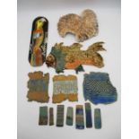 A collection of studio pottery including a three plaques (parrot by Anne Plant, fish & ammonite) and