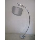 A retro style curved chrome standard lamp