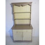 A painted pine dresser with two drawers and cupboard under