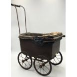 A Hamley's antique pram with paper label to front G & JL, London