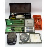 A collection of calligraphy and drawing equipment including a number of Chinese ink blocks