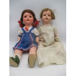 Two vintage dolls, one stamped Heubach Koppelsdorf, 320-2 and the other AM 2966,3/6 along with