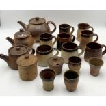 A collection of John Leach Muchelney pottery including teapots, mugs, jars etc.