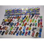 A collection of boxed and loose Hot Wheels cars, along other die-cast vehicles