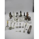 An assortment of miscellaneous items including serpentine lighthouses, glass salts, two scent