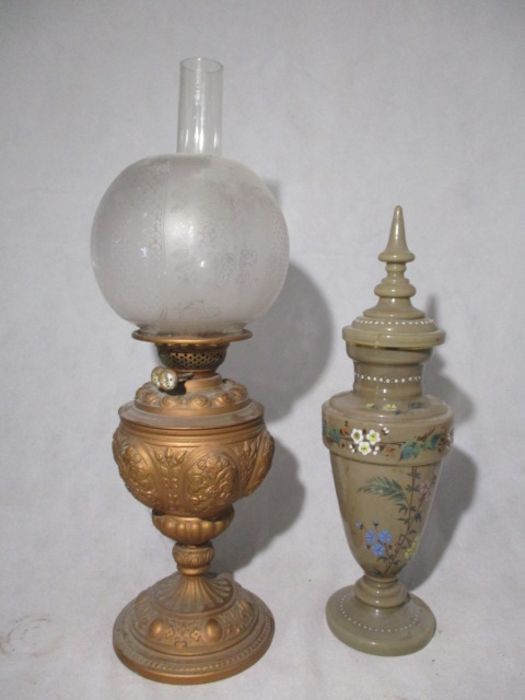 A Victorian oil lamp along with an milk glass urn with lid