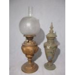 A Victorian oil lamp along with an milk glass urn with lid