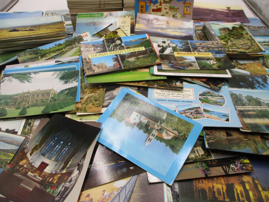 A large collection of Postcards, UK and International. Lot includes used and unused cards plus a