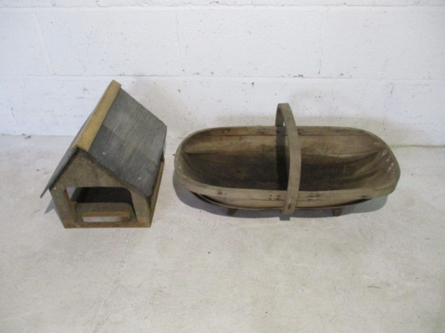 A vintage wooden trug, along with wooden bird house with slate roof